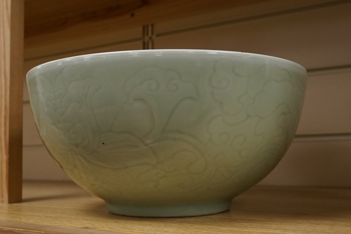 A Chinese celadon glazed ‘Phoenix’ wine ewer, late 19th century/ early 20th century, and a celadon glazed bowl, largest 26cm high